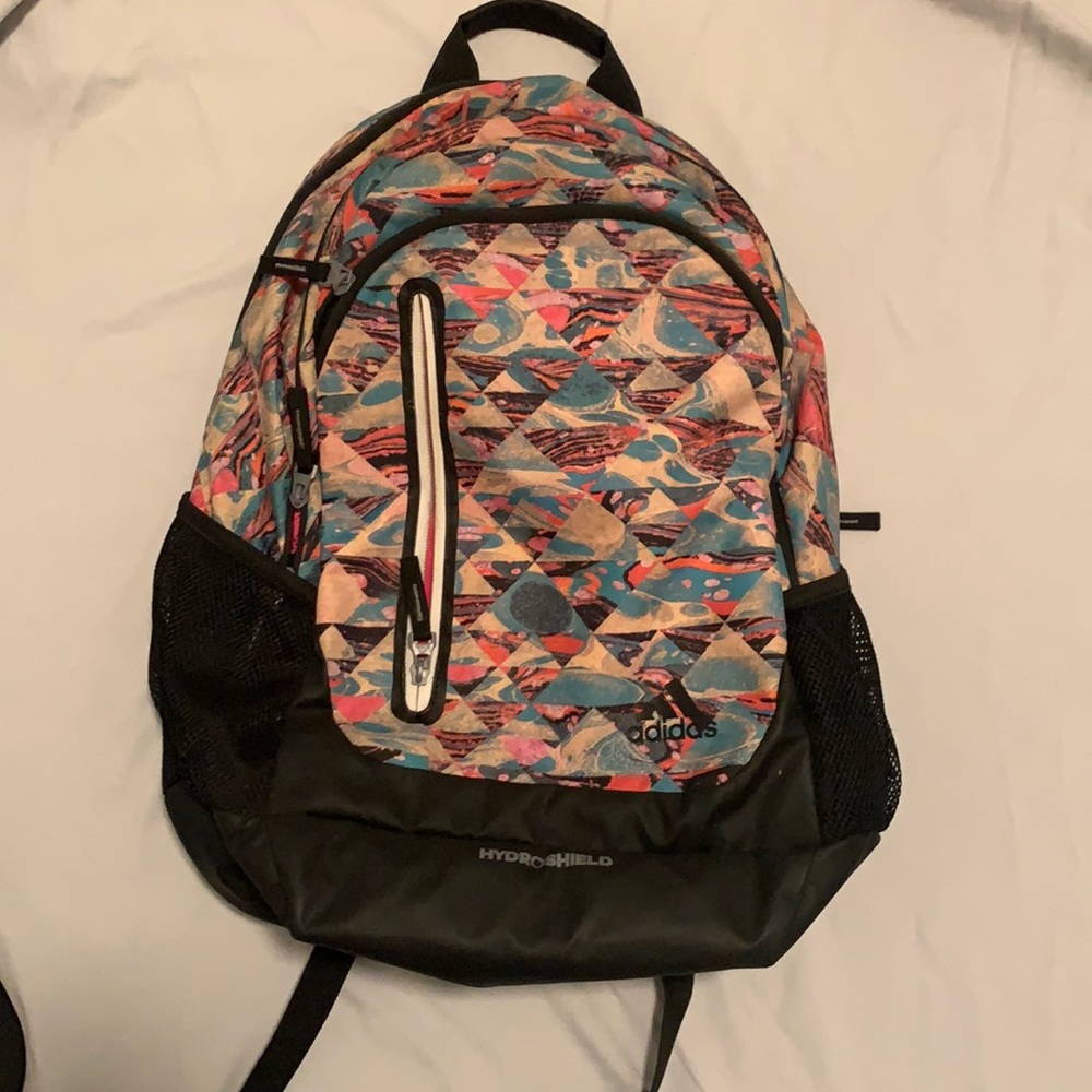 Backpack with many pockets and can hold a laptop. Spacious pockets.